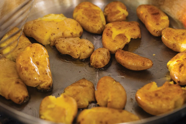 Crispy Golden Potatoes with Arugula, Parmesan, Lemon, and Capers