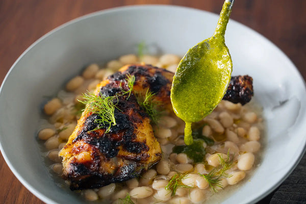 Garlicky Spatchcock Chicken with White Beans and Pesto